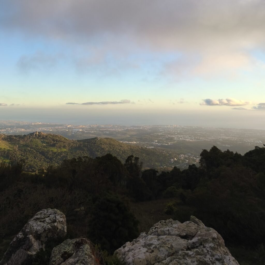 Scenic view of golden light at sunset from the Hidden Sintra Hike in the Serra de Sintra.