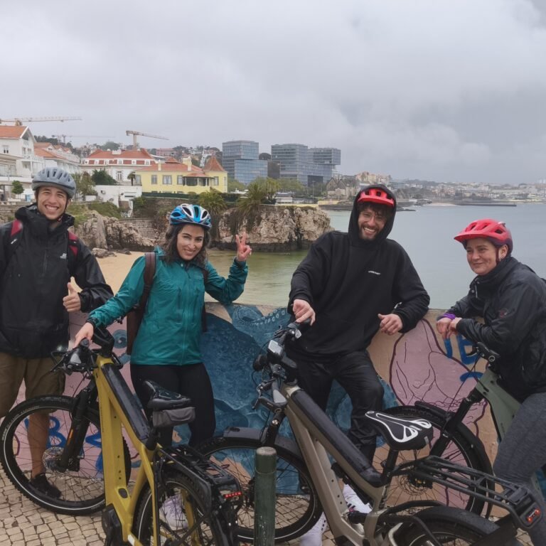 Group of cyclists starting a bike tour in Cascais, Portugal.