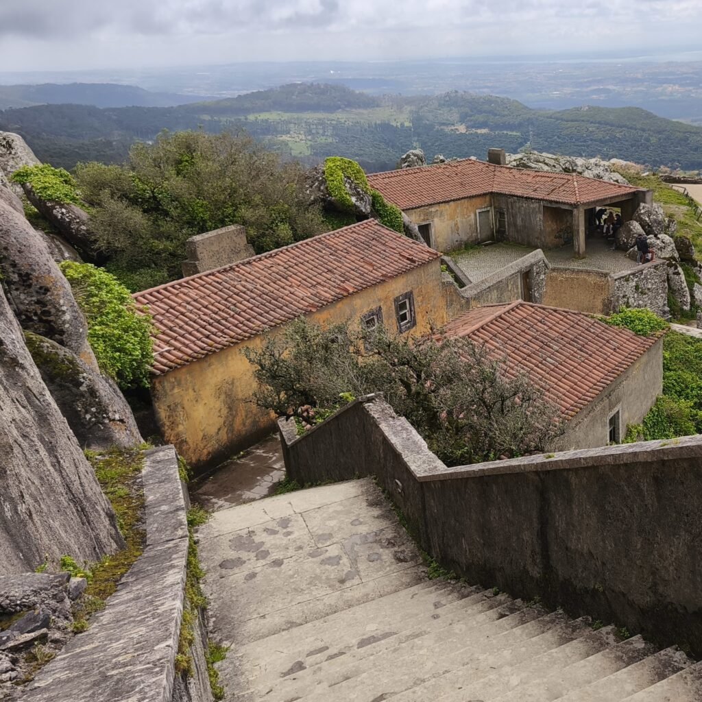 Historic stone stairway surrounded by mossy walls on the Hidden Sintra Hike near Pena Palace and Moorish Castle.