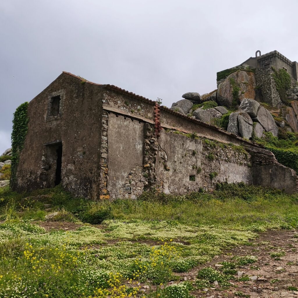 Old abandoned building surrounded by moss and nature on the Hidden Sintra Hike trail.