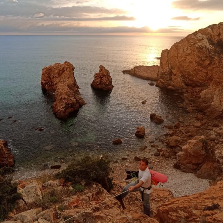Distant view of a vast sandy beach and the Atlantic Ocean from a high coastal perspective in Cascais.