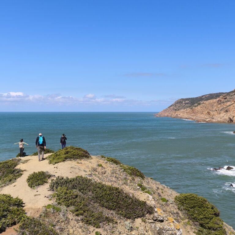 Panoramic view of a rugged headland extending into the Atlantic Ocean near Cascais.