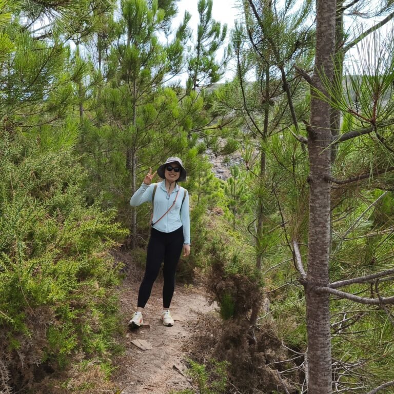 Hiker exploring a forest trail in Sintra-Cascais Natural Park during the Atlantic Wild Hike.