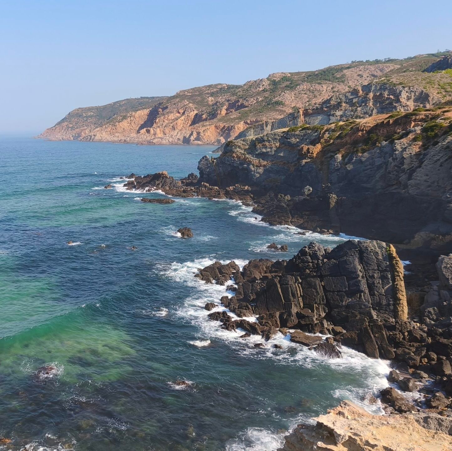 Breathtaking view from the top of the cliffs overlooking the blue Atlantic Ocean in Cascais.